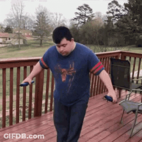 Man With Down Syndrome Jumping Rope On Wooden Deck GIF