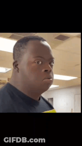Man With Down Syndrome Making Funny Face In Black Shirt GIF