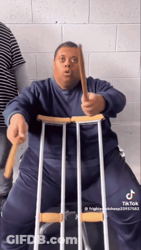 Man With Down Syndrome Making Funny Face In Black Shirt GIF