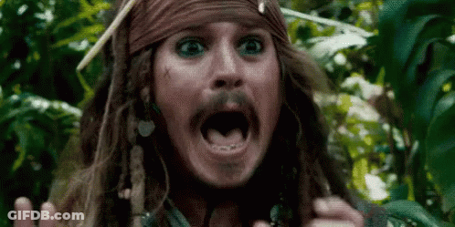 Man With Dreadlocks And Bandana Making Funny Face GIF