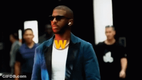 Man With Dreadlocks And Beard In Front Of Arabic Sign GIF