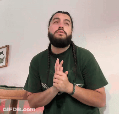 Man With Dreadlocks And Beard In Green Shirt Saying No GIF