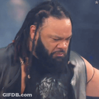 Man With Dreadlocks And Beard In Leather Vest GIF