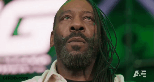 Man With Dreadlocks And Beard Looking Up Green Background GIF