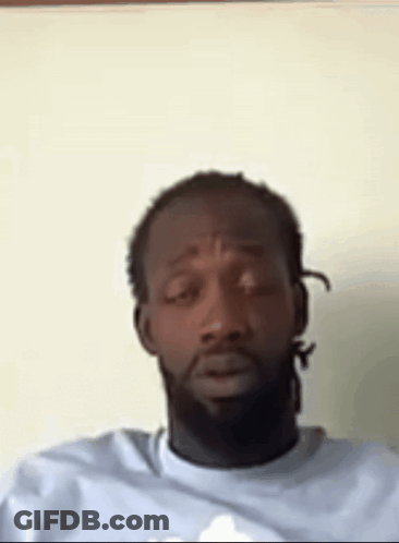 Man With Dreadlocks And Beard Sitting GIF