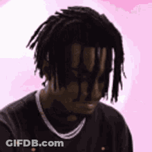 Man With Dreadlocks And Chain In Black Shirt GIF