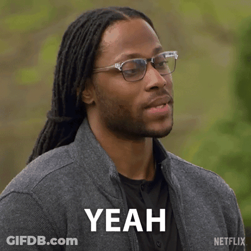 Man With Dreadlocks And Glasses Making Yeah Sign GIF