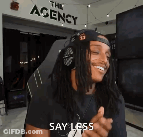 Man With Dreadlocks And Headphones Smiling In Chair GIF