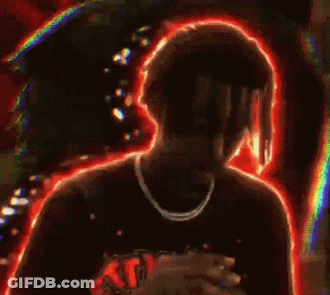 Man With Dreadlocks And Necklace In Front Of Crowd GIF