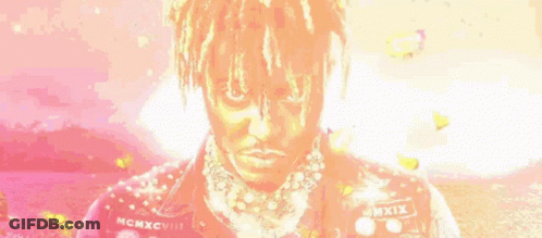 Man With Dreadlocks And Necklace In Pink Jacket GIF