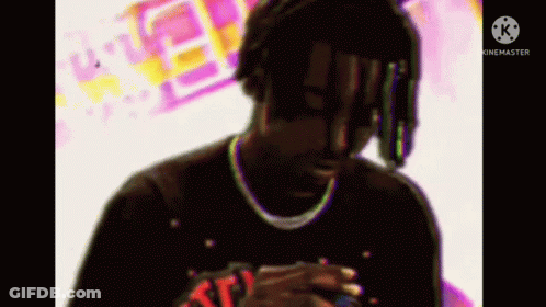 Man With Dreadlocks And Necklace Smoking Cigarette GIF