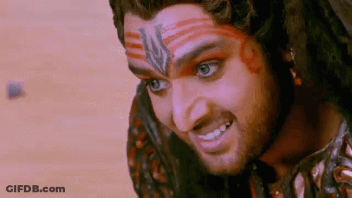 Man With Dreadlocks And Red Paint Smiling GIF