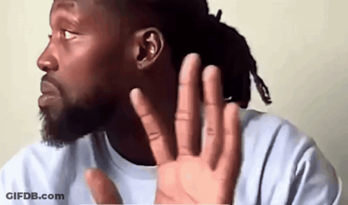 Man With Dreadlocks Covering Ear GIF