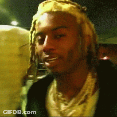 Man With Dreadlocks, Headband, And Necklace GIF
