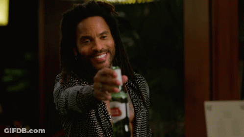 Man With Dreadlocks Holding Beer And Smiling GIF