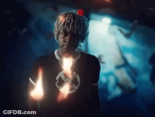 Man With Dreadlocks Holding Candle GIF