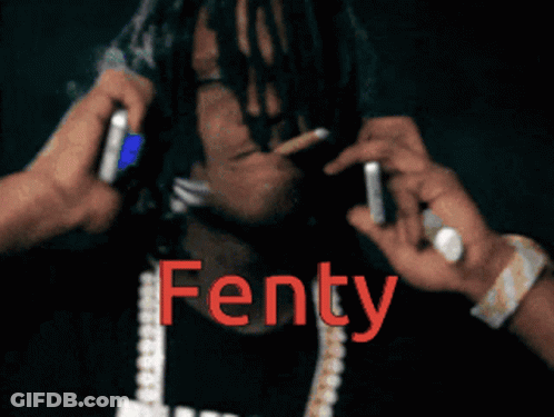 Man With Dreadlocks Holding Cell Phone Saying Fenty GIF