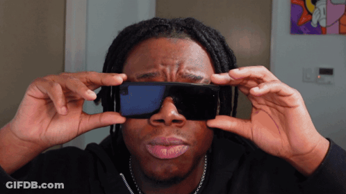Man With Dreadlocks Holding Cell Phone GIF