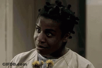 Man With Dreadlocks Holding Flowers And Funny Face GIF