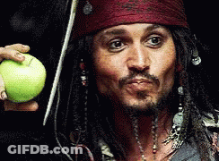 Man With Dreadlocks Holding Green Apple GIF