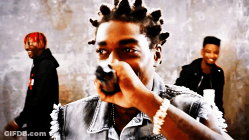 Man With Dreadlocks Holding Microphone GIF