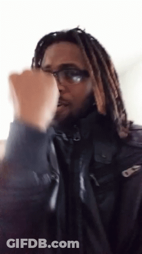 Man With Dreadlocks In Black Jacket GIF