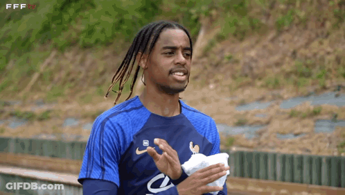 Man With Dreadlocks In FFF Shirt GIF