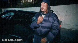 Man With Dreadlocks In Front Of Car GIF