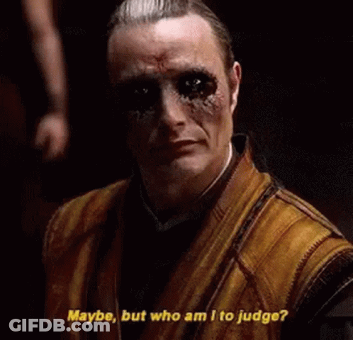 Man With Dreadlocks In Front Of Two Robots The Illuminati GIF