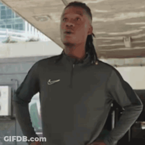 Man With Dreadlocks In Gray Nike Shirt GIF