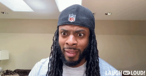 Man With Dreadlocks In NFL Headband GIF