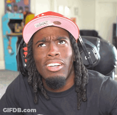 Man With Dreadlocks In Pink Mitchell And Ness Hat GIF