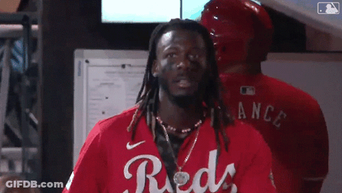 Man With Dreadlocks In Red Shirt Saying Reds GIF