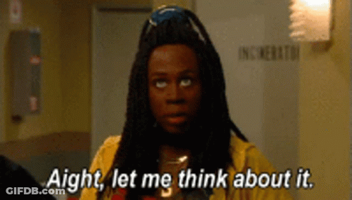 Man With Dreadlocks In Yellow Shirt Saying Aight Let Me Think About It GIF