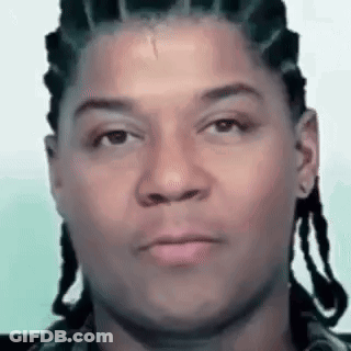 Man With Dreadlocks Looking At Camera GIF