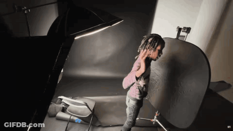 Man With Dreadlocks Making Peace Sign GIF