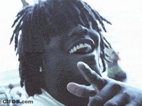 Man With Dreadlocks Making Peace Sign GIF