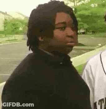 Man With Dreadlocks Next To Man In Baseball Jersey GIF