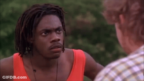 Man With Dreadlocks Next To Man In Red Tank Top GIF