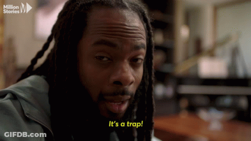 Man With Dreadlocks Says Its A Trap In Yellow Letters GIF