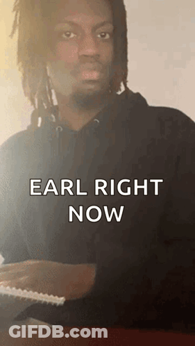 Man With Dreadlocks Sitting At Table Saying Earl Right Now GIF