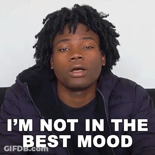 Man With Dreadlocks Sitting On Couch Says I'm Not In The Best Mood GIF