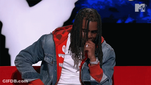 Man With Dreadlocks Sitting On Red Couch MTV Background GIF