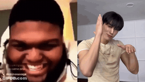 Man With Dreadlocks Smiling Next To Man In Tan Shirt GIF
