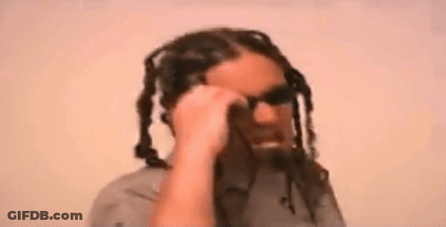Man With Dreadlocks Talking On Cell Phone Wearing Sunglasses GIF