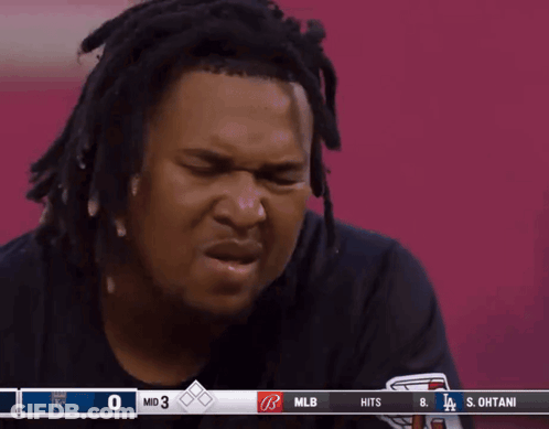 Man With Dreadlocks Watching Baseball GIF