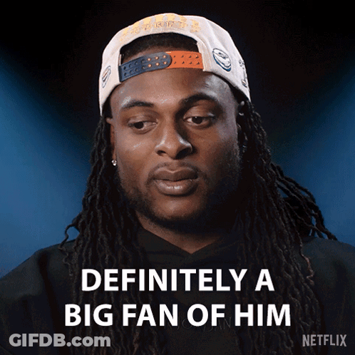 Man With Dreadlocks Wearing Fan Hat GIF