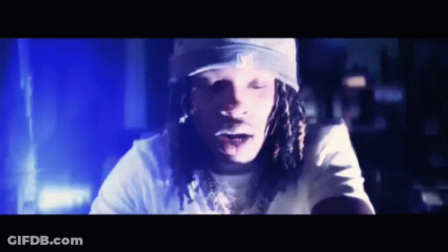 Man With Dreadlocks Wearing La Hat GIF