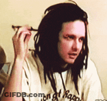 Man With Dreadlocks Wearing White Shirt Saying On Of Happiness GIF