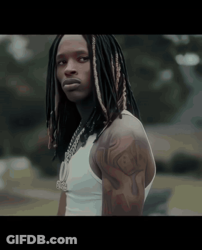 Man With Dreadlocks Wearing White Tank Top And Elise Necklace GIF